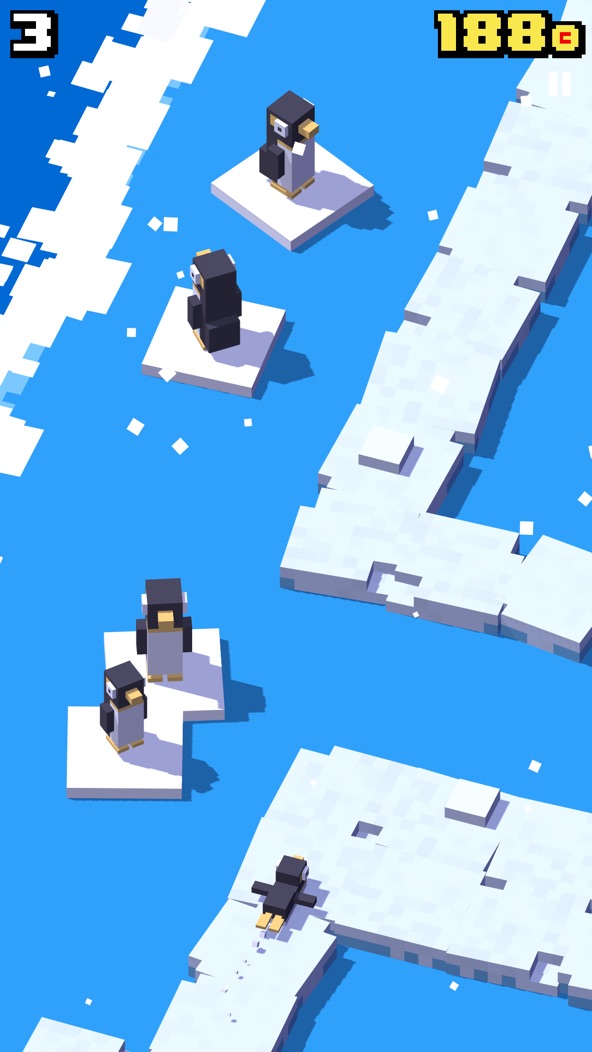 Crossy Road gameplay screenshot — a blocky penguin hopping across icy water on floating platforms