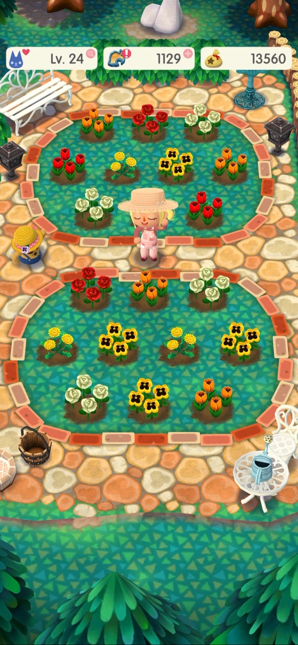 Animal Crossing: Pocket Camp Complete gameplay screenshot — a campsite garden full of flowers and cute animal neighbours