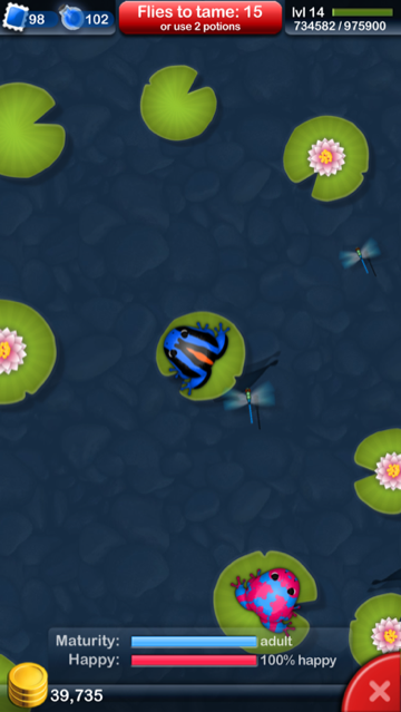 Pocket Frogs gameplay screenshot — a colourful frog on a lily pad in a calm pond with dragonflies