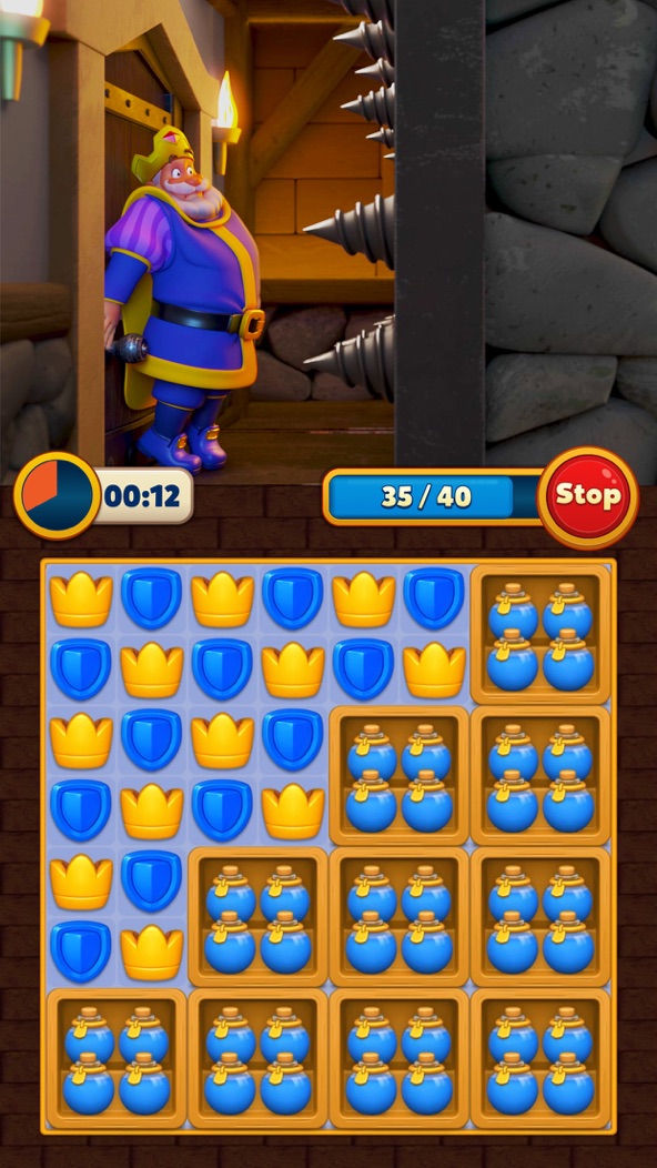 Royal Match screenshot — swapping crown and shield tiles on a match-3 board to free the king