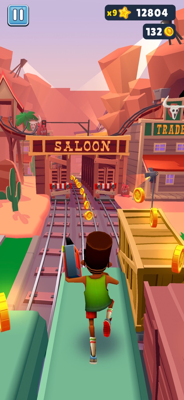 Subway Surfers gameplay screenshot — a character sprinting along train tracks grabbing coins